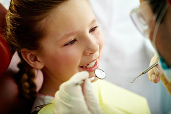 Girl during dental exam